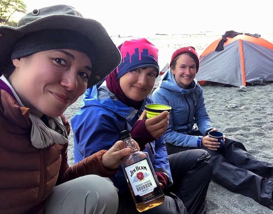 Sharing bourbon with women hikers at Camper Bay, West Coast Trail