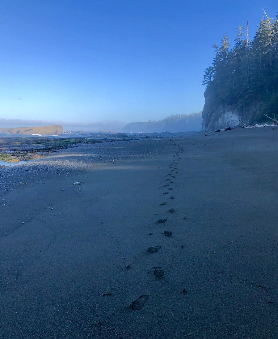 My footprints in the sand leaving Tsusiat Falls on the West Coast Trail