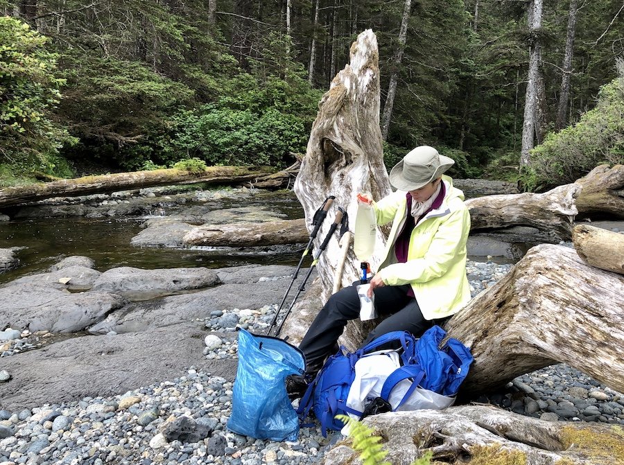 Filtering water at Laura Creek, North Coast Trail